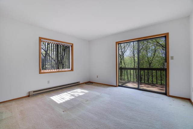 476 Hyland Dr, East Stroudsburg, PA 18301 - carpeted empty room with plenty of natural light, baseboards, and a baseboard heating unit