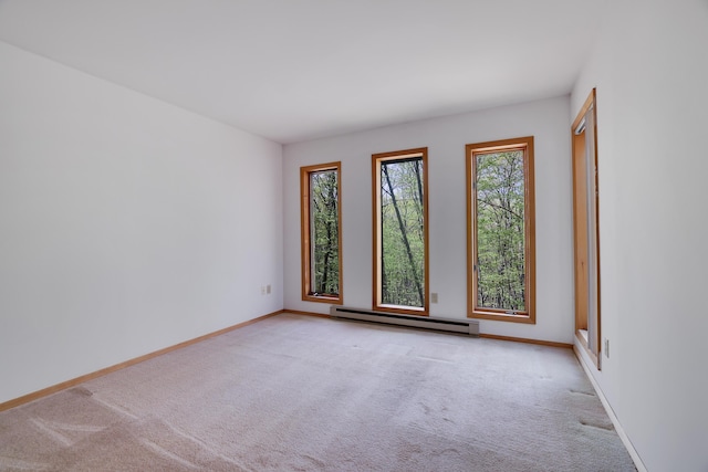 476 Hyland Dr, East Stroudsburg, PA 18301 - spare room featuring baseboards, light colored carpet, and a baseboard radiator