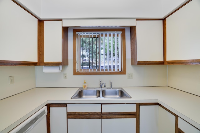 476 Hyland Dr, East Stroudsburg, PA 18301 - kitchen with a sink, light countertops, white dishwasher, and white cabinets