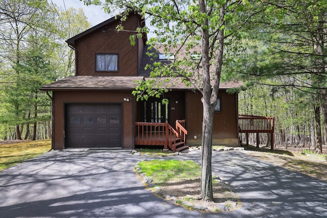 476 Hyland Dr, East Stroudsburg, PA 18301 - rustic home featuring a garage and aphalt driveway