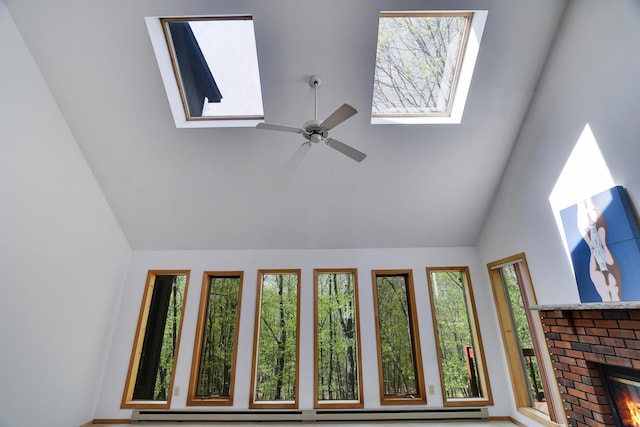 476 Hyland Dr, East Stroudsburg, PA 18301 - room details featuring a baseboard radiator, ceiling fan, a skylight, and a fireplace
