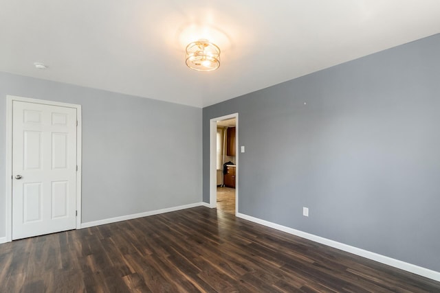 247 S 7th St, Lehighton, PA 18235 - spare room featuring dark wood-type flooring, a smoke detector, and a chandelier