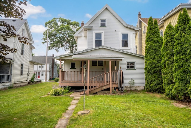247 S 7th St, Lehighton, PA 18235 - view of front facade with covered porch, a front lawn, and a chimney