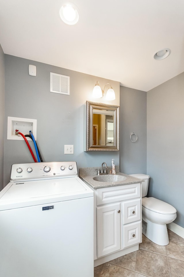 247 S 7th St, Lehighton, PA 18235 - bathroom featuring washer / clothes dryer, vanity, and tile patterned flooring