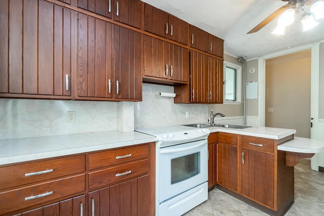 247 S 7th St, Lehighton, PA 18235 - kitchen featuring white electric range oven, a peninsula, ceiling fan, and backsplash