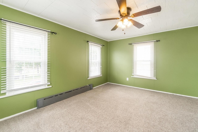 247 S 7th St, Lehighton, PA 18235 - spare room featuring a baseboard radiator, ceiling fan, carpet floors, and crown molding