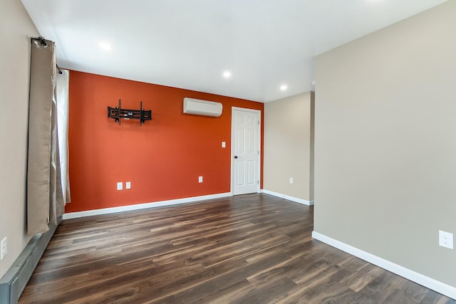 247 S 7th St, Lehighton, PA 18235 - unfurnished room featuring an AC wall unit, dark wood finished floors, and recessed lighting