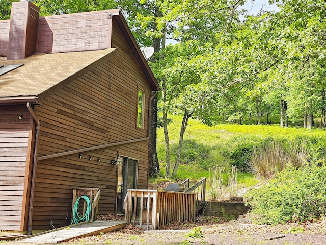 5081 Woodbridge Dr E, Bushkill, PA 18324 - view of side of home featuring a chimney