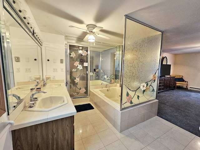 5081 Woodbridge Dr E, Bushkill, PA 18324 - full bathroom with tile patterned floors, a garden tub, double vanity, ceiling fan, and baseboard heating