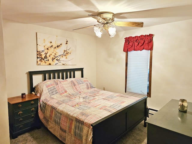 5081 Woodbridge Dr E, Bushkill, PA 18324 - bedroom with dark colored carpet, a baseboard heating unit, and ceiling fan