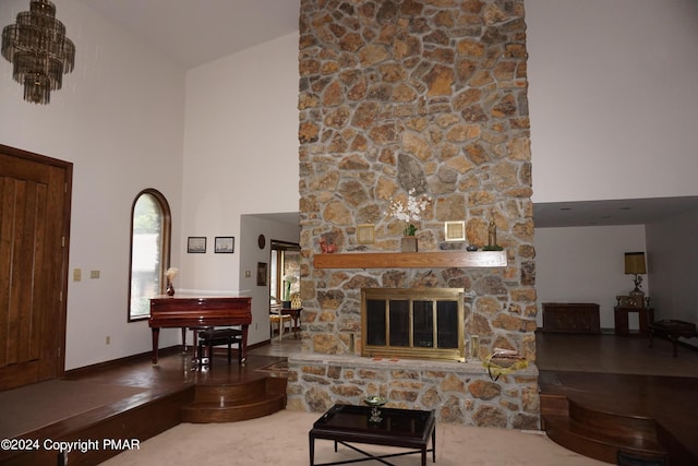6760 Bear Creek Blvd, Bear Creek Township, PA 18702 - living room featuring a fireplace, high vaulted ceiling, and visible vents