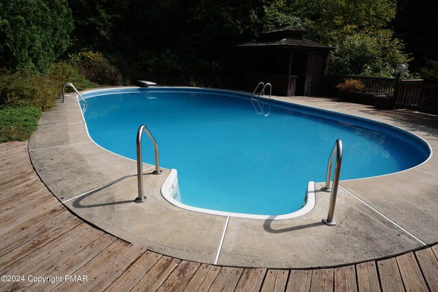6760 Bear Creek Blvd, Bear Creek Township, PA 18702 - view of swimming pool with a gazebo, a deck, and a fenced in pool