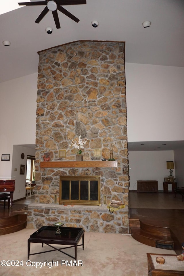6760 Bear Creek Blvd, Bear Creek Township, PA 18702 - living area featuring a ceiling fan, a stone fireplace, and high vaulted ceiling