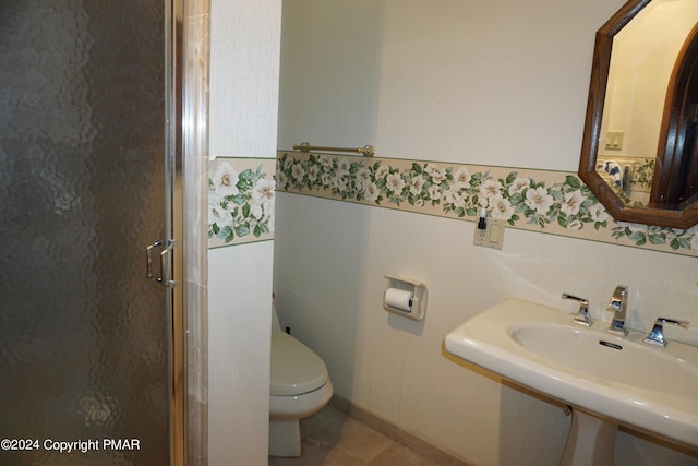 6760 Bear Creek Blvd, Bear Creek Township, PA 18702 - bathroom featuring a shower stall, a wainscoted wall, toilet, and a sink