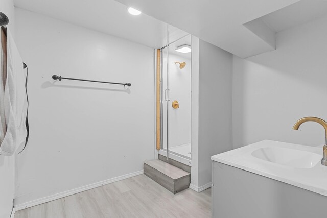 840 Columbus Ave, Stroudsburg, PA 18360 - full bathroom with wood finished floors, a stall shower, baseboards, and vanity