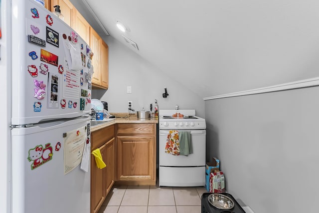 840 Columbus Ave, Stroudsburg, PA 18360 - kitchen with white appliances, lofted ceiling, light tile patterned flooring, and light countertops