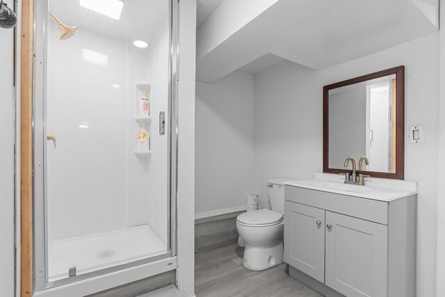840 Columbus Ave, Stroudsburg, PA 18360 - bathroom featuring a stall shower, vanity, toilet, and wood finished floors