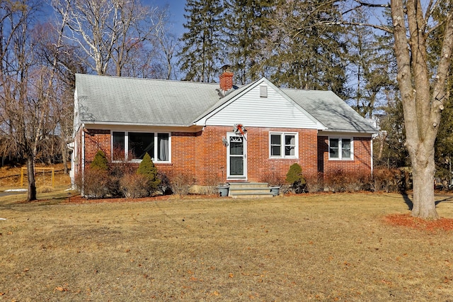 840 Columbus Ave, Stroudsburg, PA 18360 - bungalow-style house with a front lawn, a chimney, brick siding, and roof with shingles