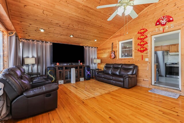 840 Columbus Ave, Stroudsburg, PA 18360 - living area with light wood-style flooring, lofted ceiling, a ceiling fan, wooden walls, and wooden ceiling