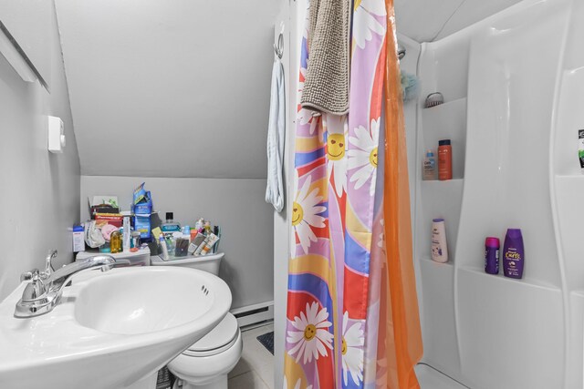 840 Columbus Ave, Stroudsburg, PA 18360 - full bathroom with a sink, a shower with curtain, vaulted ceiling, a baseboard heating unit, and toilet