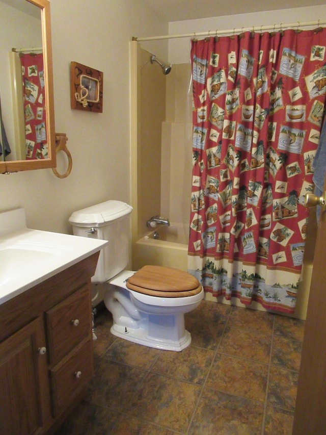 full bathroom with shower / bath combination with curtain, toilet, and vanity