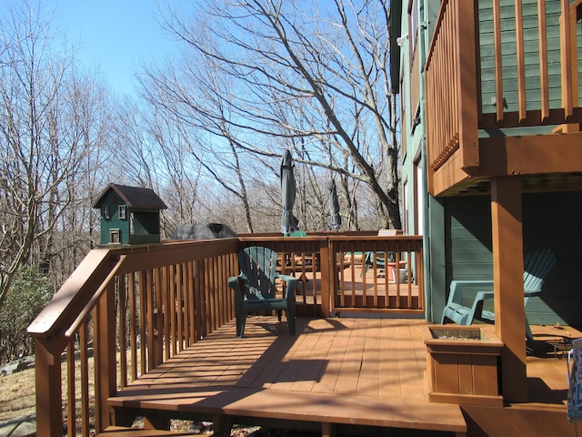 wooden terrace featuring outdoor dining space