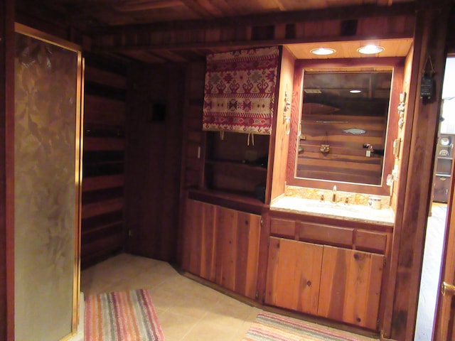 bathroom featuring tile patterned flooring and vanity