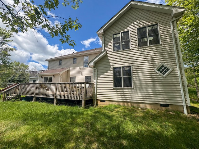 439 Cedar Dr, Long Pond, PA 18334 - back of house with crawl space, a wooden deck, and a lawn