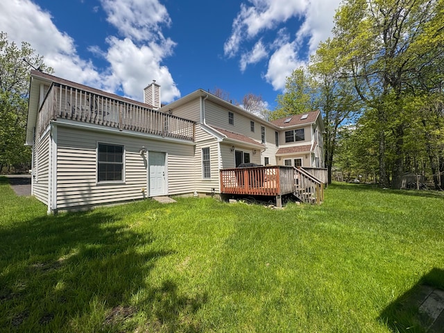 439 Cedar Dr, Long Pond, PA 18334 - rear view of property featuring a chimney, a lawn, and a wooden deck