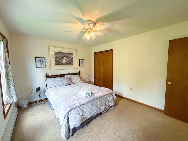 439 Cedar Dr, Long Pond, PA 18334 - carpeted bedroom featuring a closet, a baseboard heating unit, ceiling fan, and baseboards