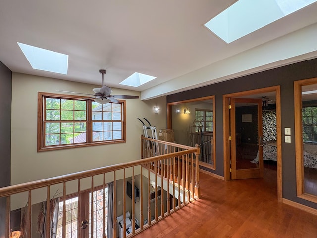 439 Cedar Dr, Long Pond, PA 18334 - corridor with a skylight, an upstairs landing, wood finished floors, and baseboards