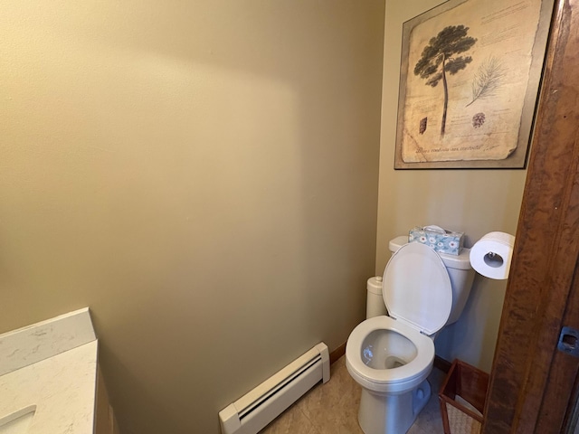 439 Cedar Dr, Long Pond, PA 18334 - half bathroom with a baseboard heating unit, toilet, baseboards, and tile patterned floors