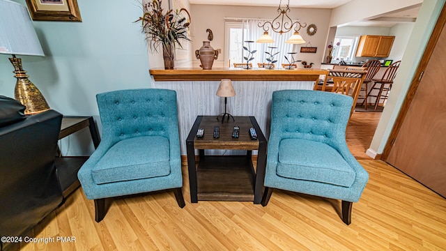 sitting room with light wood-style floors and baseboards