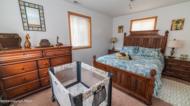 bedroom featuring carpet flooring and visible vents