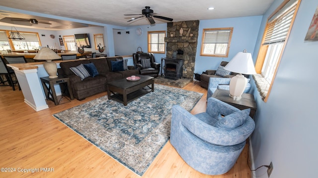 living room featuring hardwood / wood-style flooring and ceiling fan