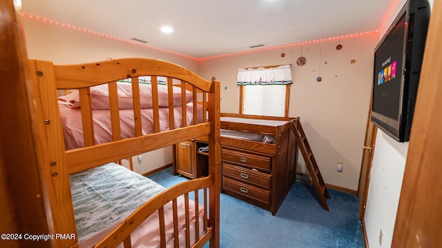 carpeted bedroom with baseboards