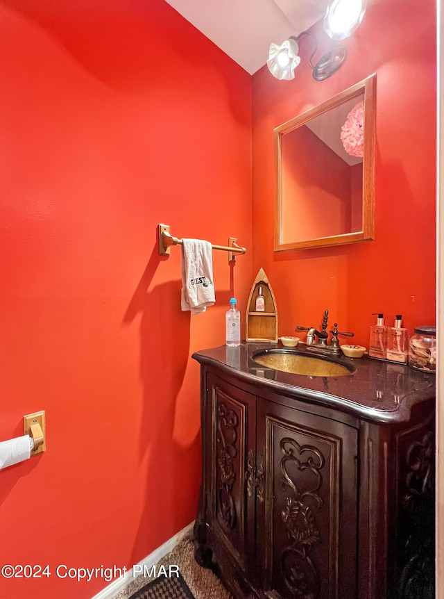 bathroom with vanity and baseboards