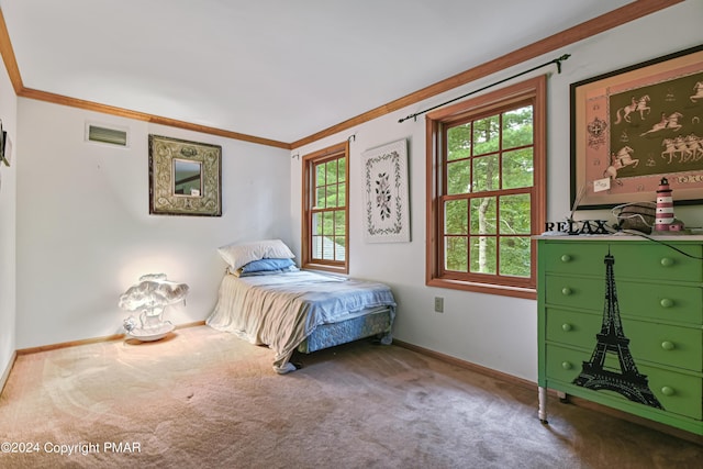 bedroom featuring baseboards, visible vents, crown molding, and carpet flooring