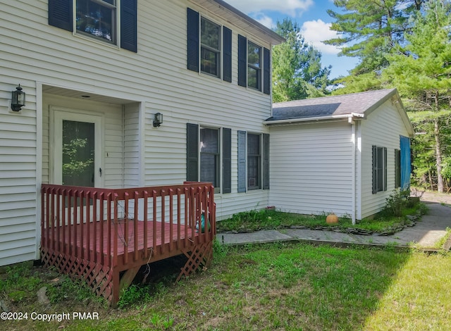 rear view of house featuring a deck