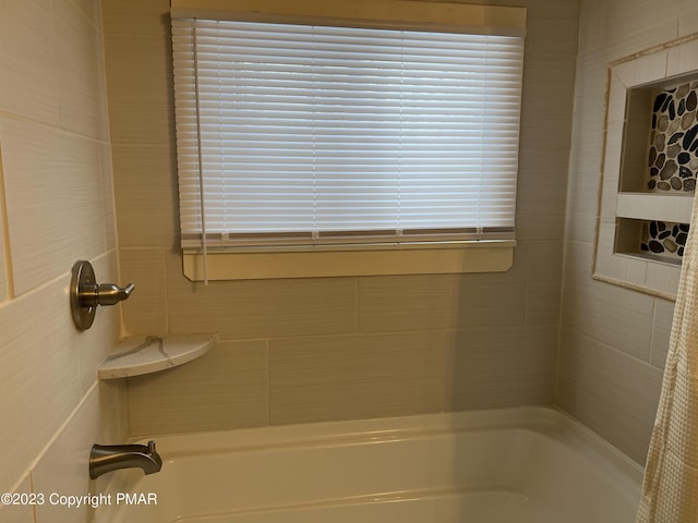 full bath featuring shower / bathtub combination