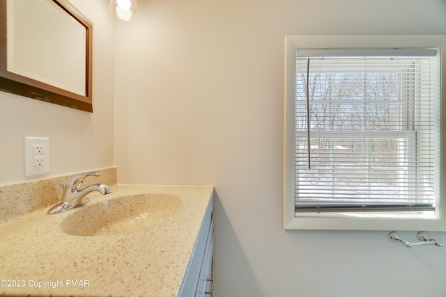 bathroom featuring plenty of natural light and vanity