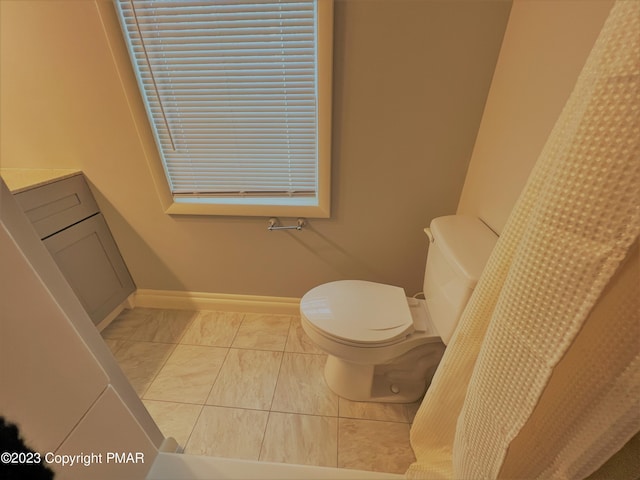 full bath with marble finish floor, baseboards, and toilet