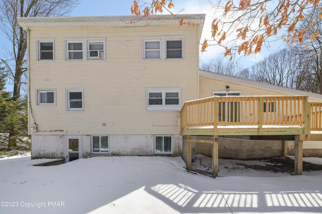 back of house with a wooden deck