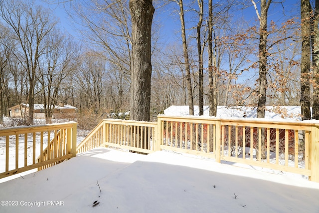 view of snow covered deck