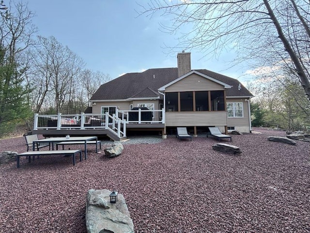 389 Joanne Ct, Bartonsville, PA 18321 - back of house with a sunroom, a chimney, and a deck