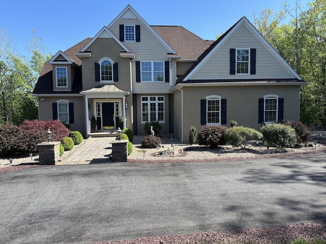 389 Joanne Ct, Bartonsville, PA 18321 - traditional-style home with stucco siding and a shingled roof