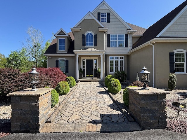 389 Joanne Ct, Bartonsville, PA 18321 - traditional-style house featuring stucco siding