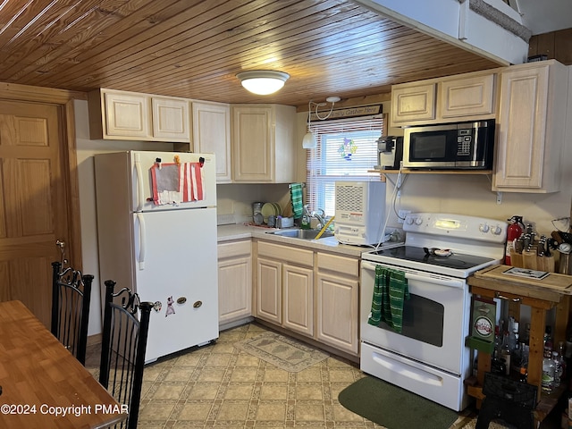 kitchen with white appliances, wooden ceiling, light countertops, light floors, and a sink