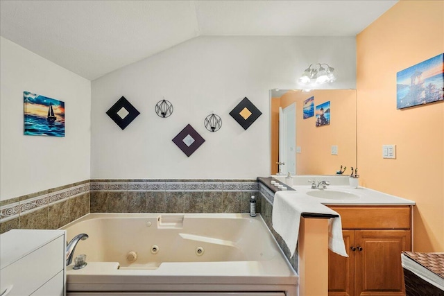 349 Mallard Ln, Bushkill, PA 18324 - bathroom featuring a whirlpool tub, vanity, and lofted ceiling