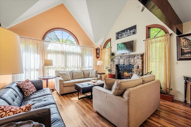 349 Mallard Ln, Bushkill, PA 18324 - living area with a fireplace, hardwood / wood-style flooring, healthy amount of natural light, and high vaulted ceiling